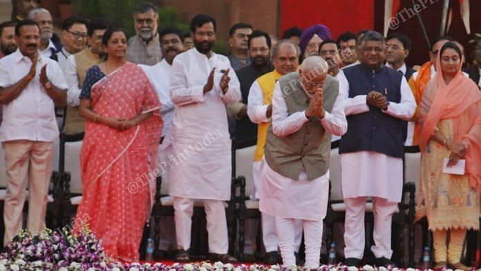 PM Narendra Modi greets audience as Council of Ministers stand in background | Photo: Praveen Jain | ThePrint