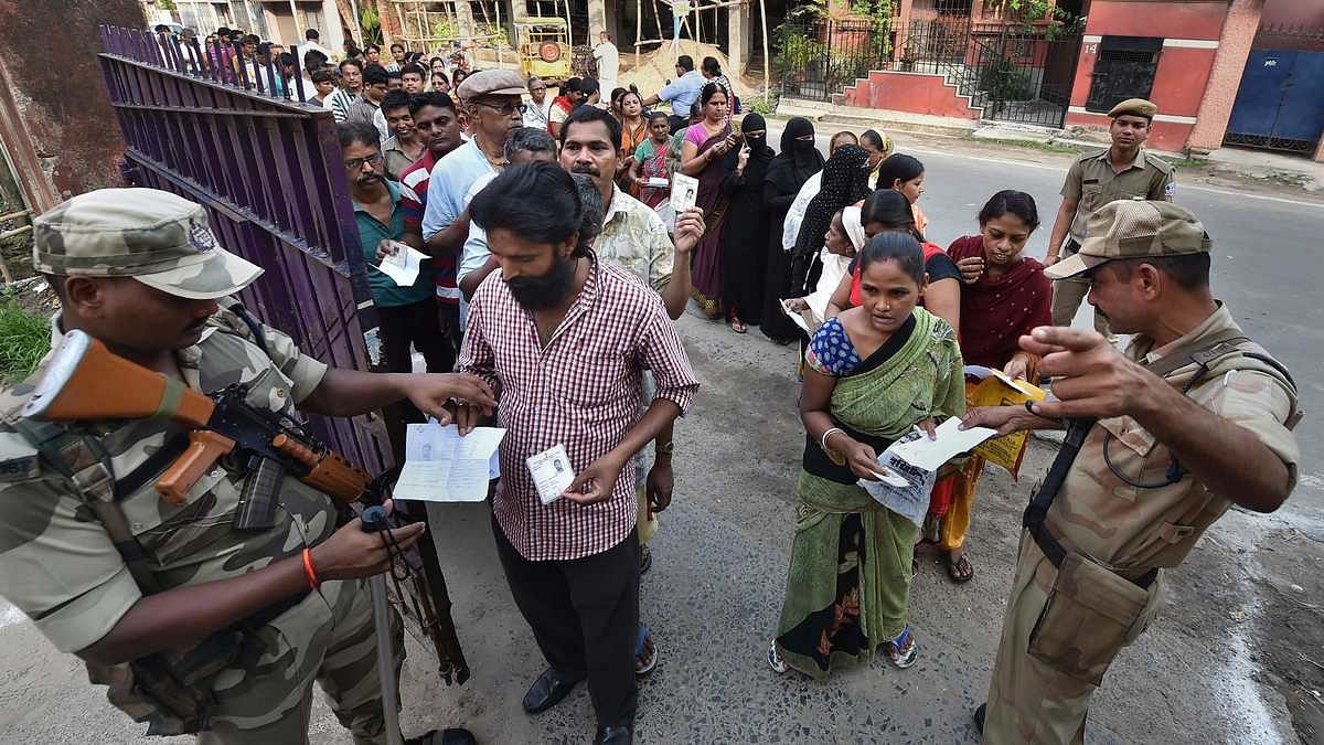 Lok Sabha polls Phase 5 Paramilitary soldiers check identity cards of voters before they enter a polling station during the 5th phase of Lok Sabha elections, in Howrah district, West Bengal, on May 6, 2019 | Swapan Mahapatra | PTI Photo