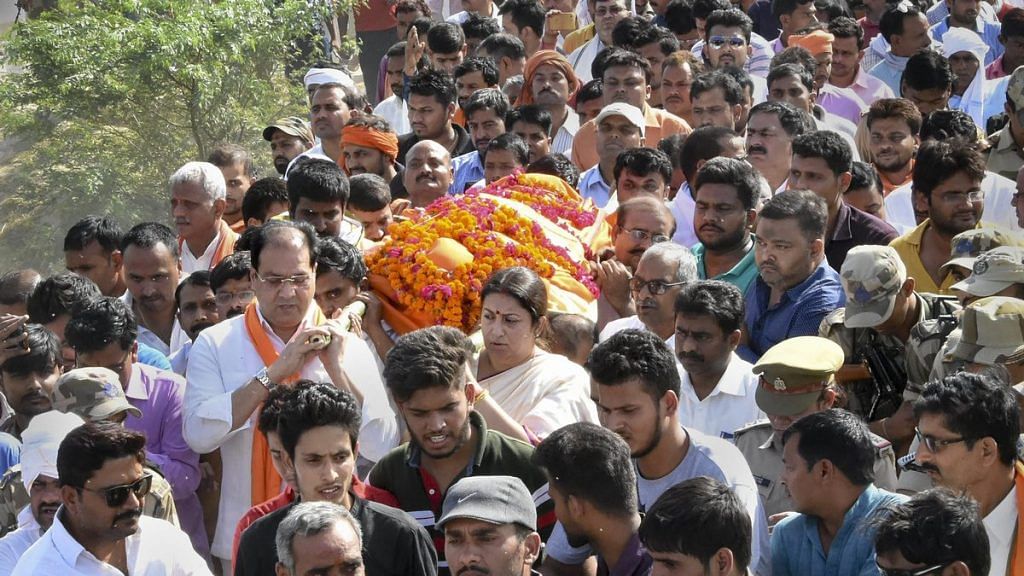 BJP MP Smriti Irani carries slain former village head Surendra Singh during his funeral, Amethi | PTI