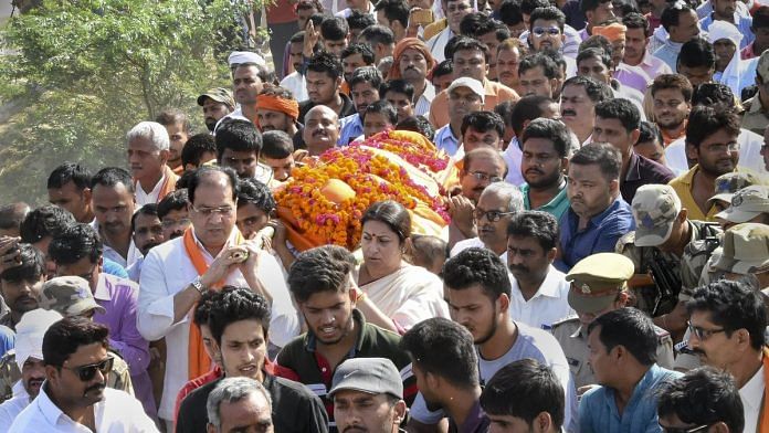 BJP MP Smriti Irani carries slain former village head Surendra Singh during his funeral, Amethi | PTI