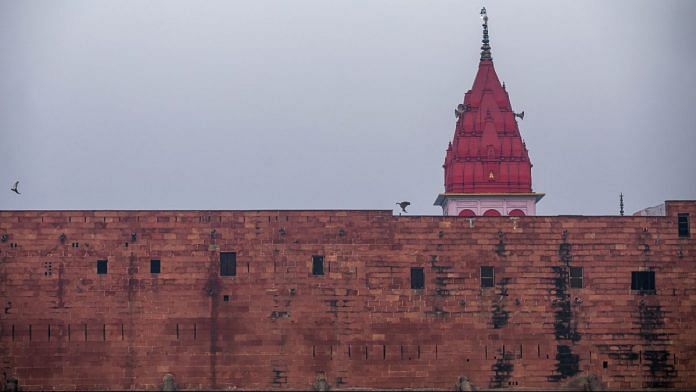 Representational image| A Hindu temple is seen over a city wall in Uttar Pradesh| Photo: Prashanth Vishwanathan/Bloomberg