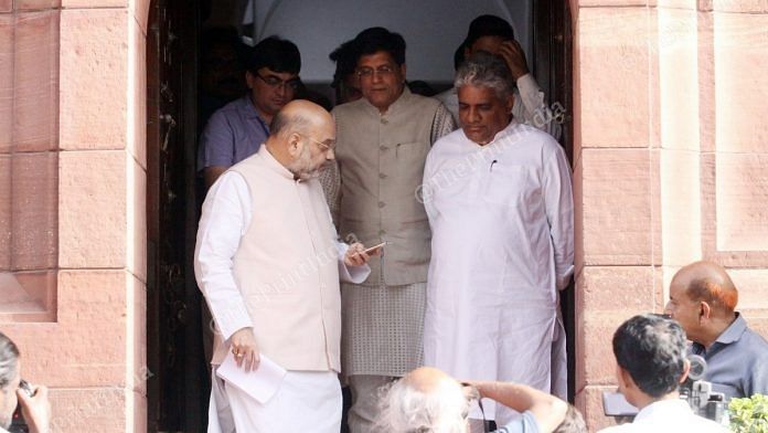 Union ministers Amit Shah and Piyush Goyal with Rajya Sabha MP Bhupender Yadav outside Parliament during the Budget session, on 28 June, 2019 | Praveen Jain | ThePrint