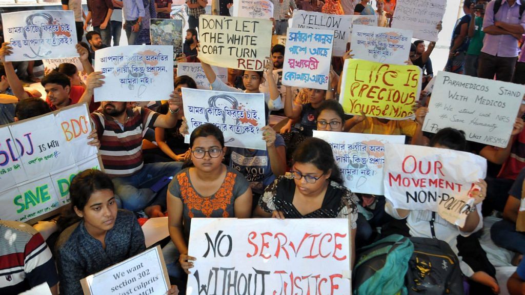 Junior doctors hold placards during their strike in protest against an attack on an intern doctor in Kolkata. | File photo: PTI