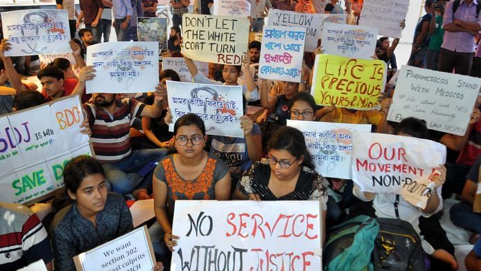 Junior doctors hold placards during their strike in protest against an attack on an intern doctor in Kolkata. | File photo: PTI