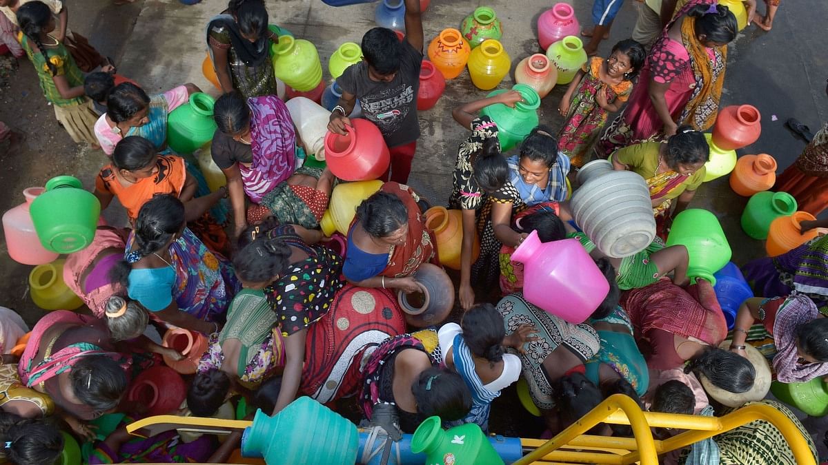 People rush to fill their vessels from a water tanker in Chennai | File photo: PTI