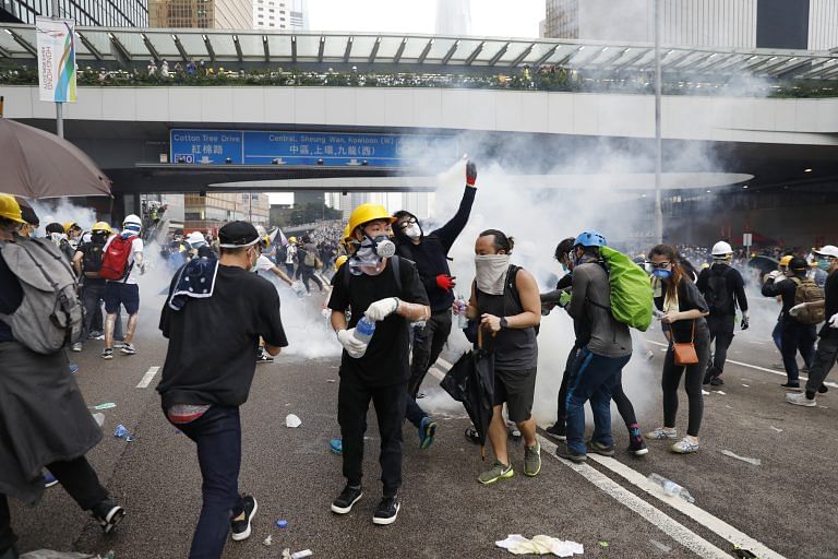 Hong Kong protesters target shopping malls, harass mainland Chinese