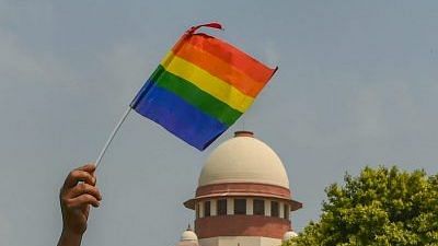 Representational image | An activist waves a pride flag in front of the Supreme Court | Photo: Kamal Kishore | PTI