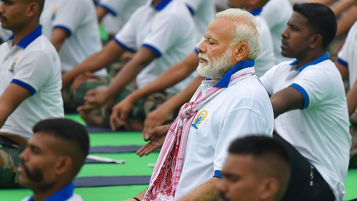 Prime Minister Narendra Modi performs yoga during a mass yoga event on the 5th International Day of Yoga at Prabhat Tara ground, in Ranchi. | PTI