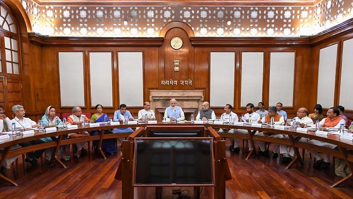 Prime Minister Narendra Modi with union ministers during the first cabinet meeting, at the Prime Minister's Office, in South Block, New Delhi. | PTI Photo