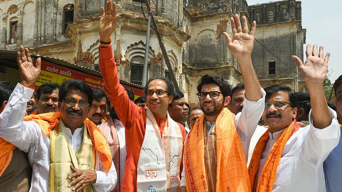 File photo of Shiv Sena chief Uddhav Thackeray with son Aaditya and party leader Sanjay Raut (right)