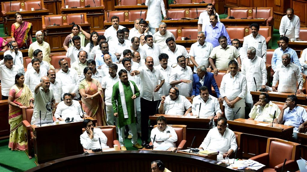 Congress MLAs shout slogans and demand to adjourned the assembly session for the day at Vidhana Soudha | PTI