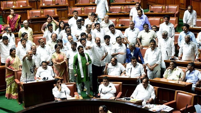 Congress MLAs shout slogans and demand to adjourned the assembly session for the day at Vidhana Soudha | PTI