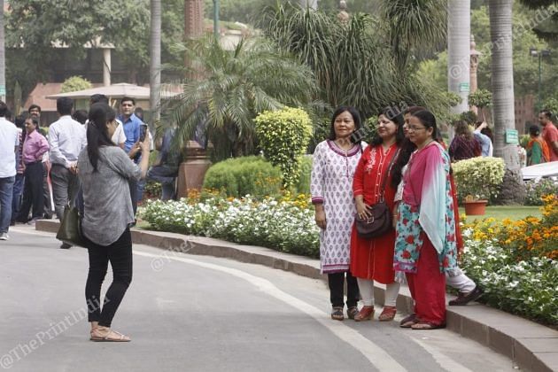 Employees click photographs during the Swachhta Abhiyan event