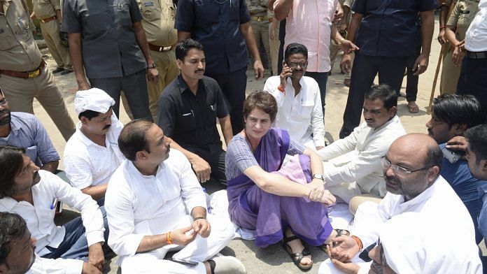 Congress General Secretary Priyanka Gandhi Vadra sat in protest after she was stopped from proceeding to Sonbhadra, in Mirzapur | PTI