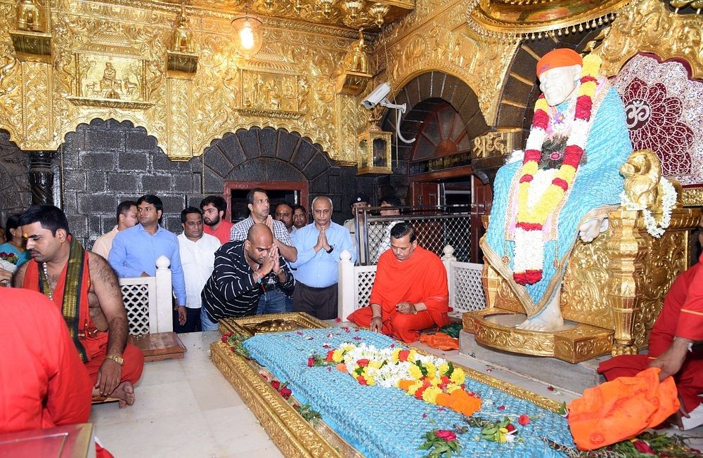Rebel Karnataka MLAs pay obeisance to Saibaba at the temple in Shirdi. | ANI