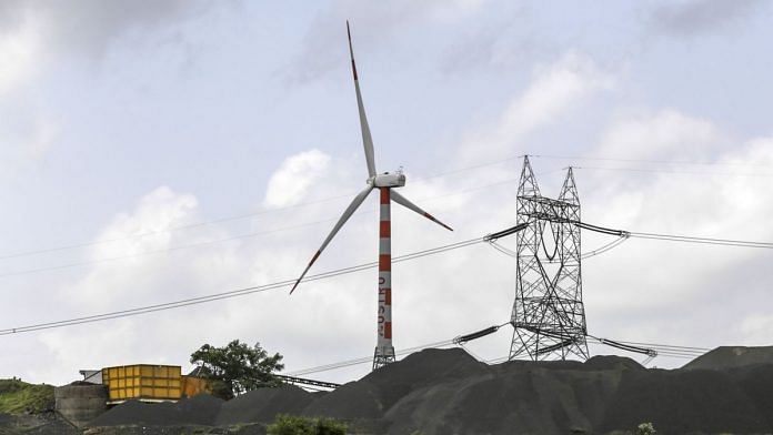 Wind turbines stand at the Ostro Energy Pvt. Ltd., wind farm in Dewas, Madhya Pradesh. | Photographer: Dhiraj Singh | Bloomberg