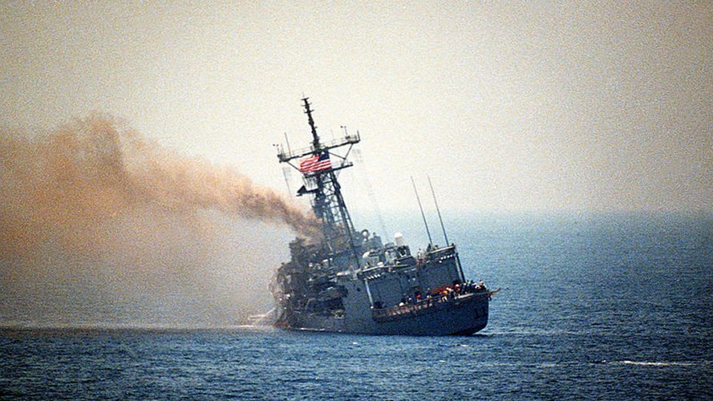 In the Persian Gulf, a port quarter view of the guided missile frigate USS STARK (FFG-31) listing to port after being hit by two Iraqi Exocet missiles, 1987 | Commons