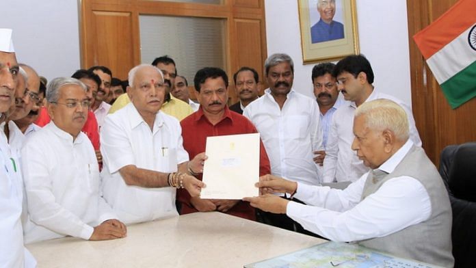 Karnataka BJP president B.S. Yeddyurappa submits a letter to Governor Vajubhai Vala staking claim to form the state government, in Raj Bhavan on 26 July, 2019 | Photo: Raj Bhavan