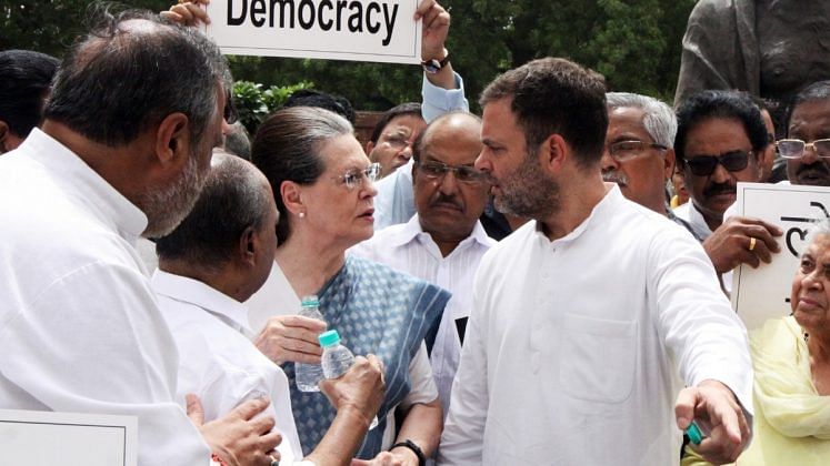 Rahul Gandhi indicates something to Sonia Gandhi.