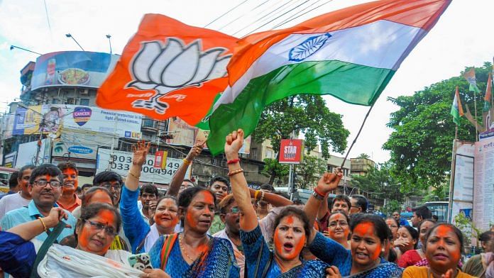 BJP supporters wave the tricolor as they celebrate Modi government's move to revoke Article 370, Kolkata | PTI