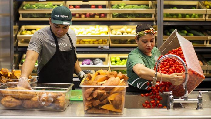 Workers prepare food at a restaurant (Representational Image) | Photographer: Adam Glanzman | Bloomberg