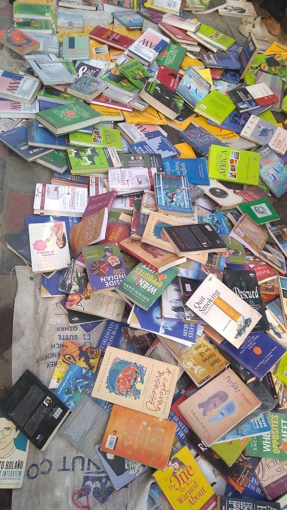 Books lying on the pavement at the Sunday market | Photo: Sajid Ali | ThePrint