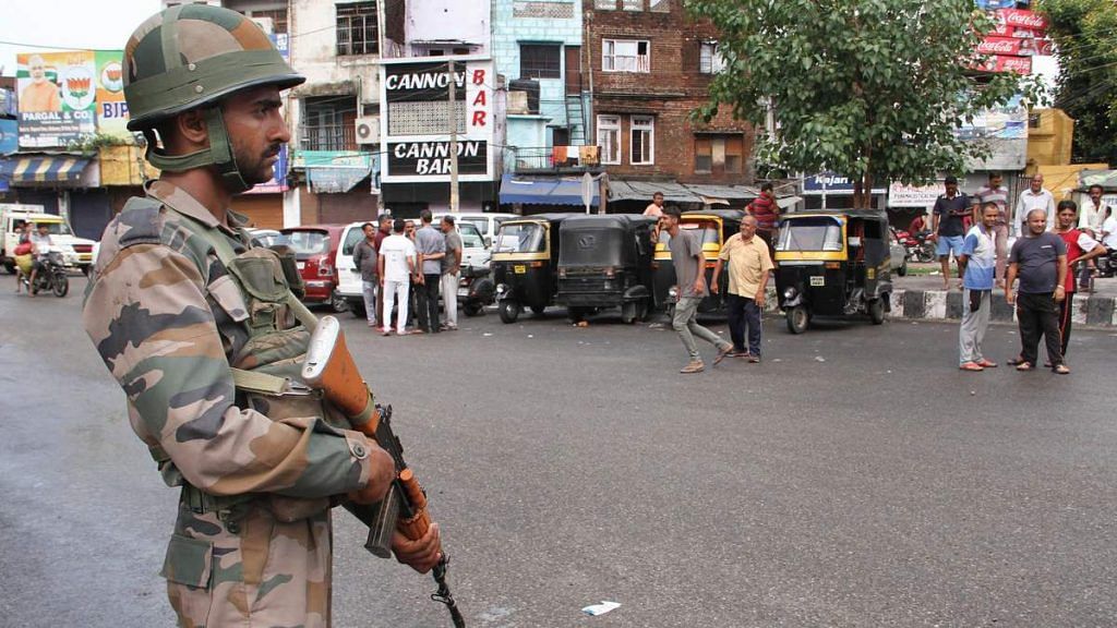 Army personnel stand guard during restrictions in Jammu, on 5 August, 2019 | PTI