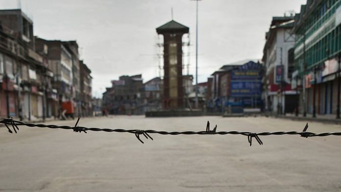 A view of a deserted street during restrictions at Lal Chowk in Srinagar on 8th August. | PTI