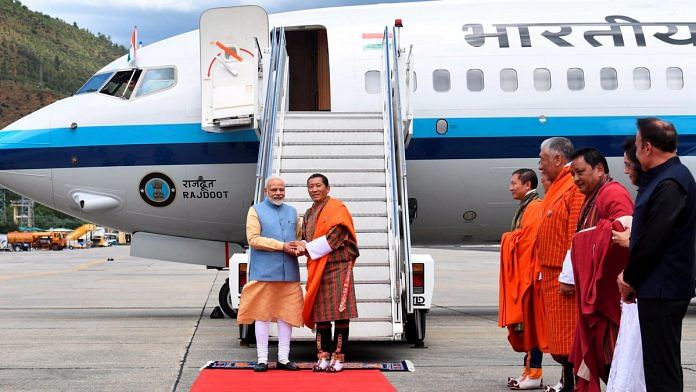 Prime Minister Narendra Modi being welcomed by his Bhutanese counterpart Lotay Tshering | Photo: PTI