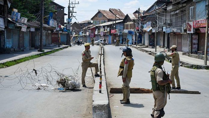 Security personnel stand guard during restrictions in Srinagar | PTI