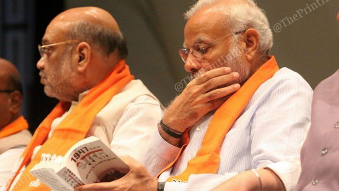 PM Narendra Modi reading a book | Praveen Jain | ThePrint