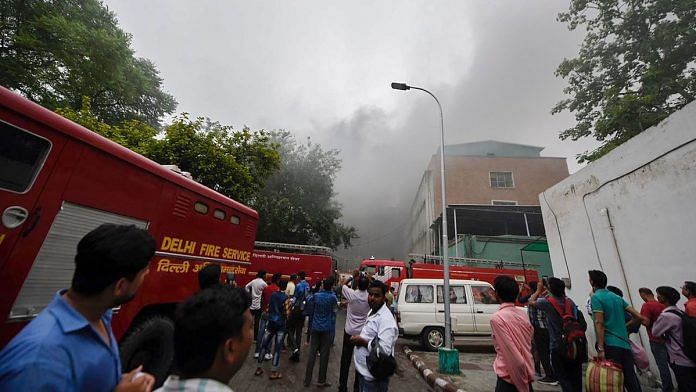 Smoke billows out after a fire broke out at the teaching block of the All India Institute of Medical Sciences