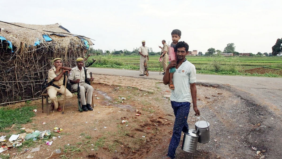 Policemen stationed outside Ubha village, where the massacre occured on 17 July. | Praveen Jain | ThePrint