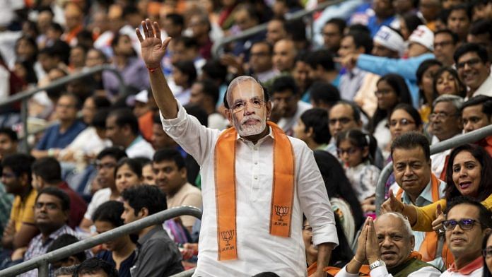 File photo | An attendee wears a mask of Indian Prime Minister Narendra Modi at the 'Howdy, Modi!' event in Houston, Texas | Photo: Scott Dalton | Bloomberg