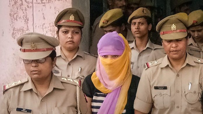 Law student (face covered), who alleged BJP leader Chinmayanand of sexual misconduct and harassment in Shahjahanpur on 25 September | PTI Photo