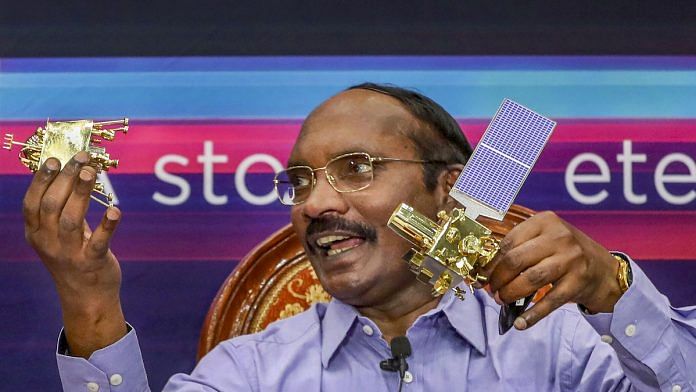 ISRO Chairman K Sivan displays a model of Chanrayaan 2 orbiter and rover during a press conference in Bengaluru on 20 August. | PTI