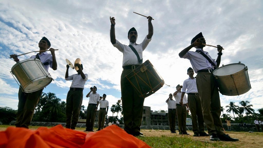RSS members participate in a parade in Dharmanagar on 28 September | PTI Photo