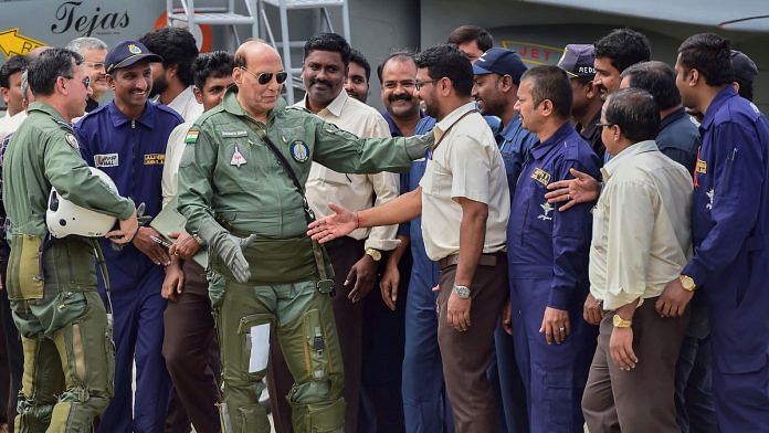 Defence Minister Rajnath Singh meets HAL employees after a sortie in LCA Tejas in Bengaluru on 19 September | PTI