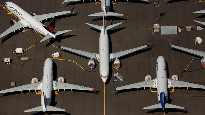 Boeing 737 Max planes sit idle as the company continues to work on the software glitch that contributed to two fatal Jetliner crashes. | Bloomberg