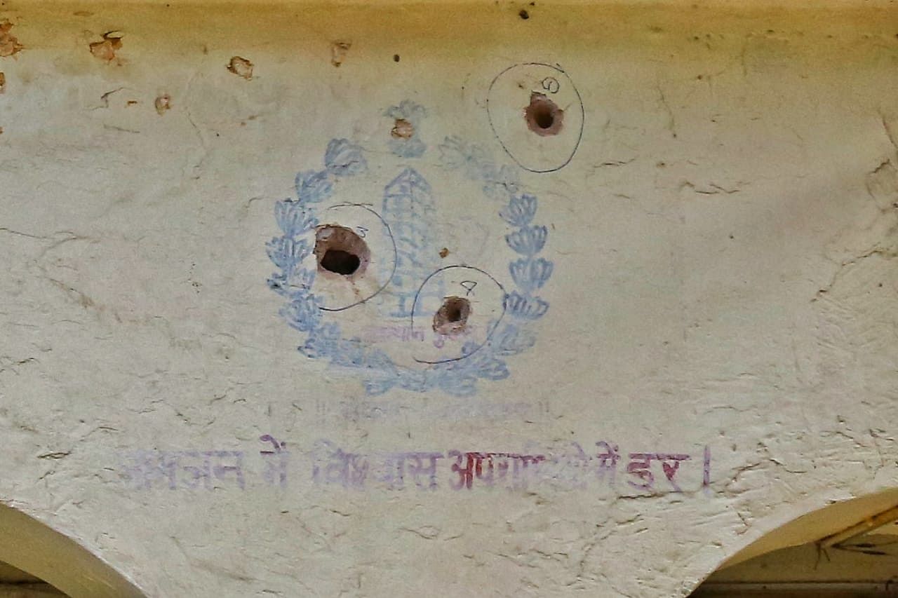 Bullet holes in the police station, where the armed men shot at. | Photo: Suraj Singh Bisht | ThePrint