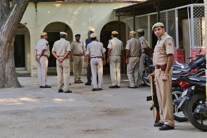 Policemen stand outside Behror police station during an inspection. | Photo: Suraj Singh Bisht | ThePrint