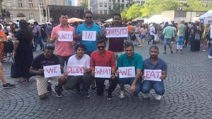 A group of Indians protest the removal of beef from the menu at Indien Fest | Twitter