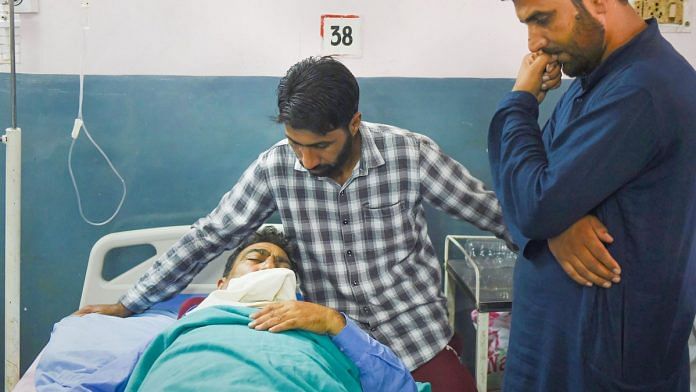 Injured fruit dealer Mohammad Ashraf Dar undergoing treatment at a hospital, in Srinagar. | PTI