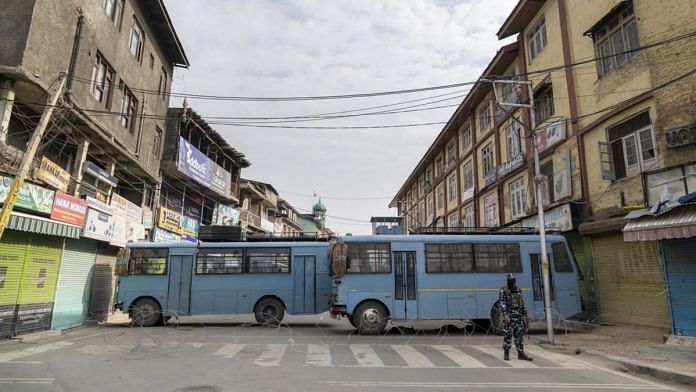 Central Reserve Police Force Buses block a street in Srinagar | Photographer: Sumit Daya | Bloomberg