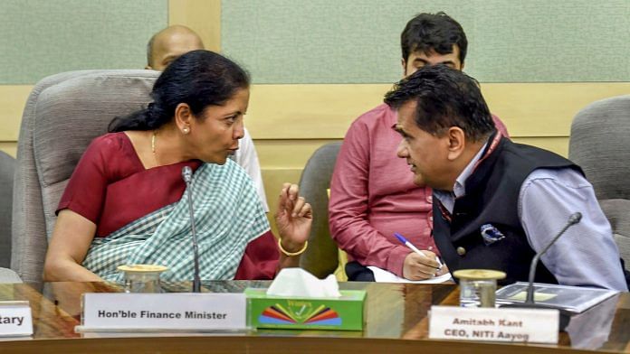 Finance Minister Nirmala Sitharaman speaks with NITI Aayog CEO Amitabh Kant during a meeting | PTI