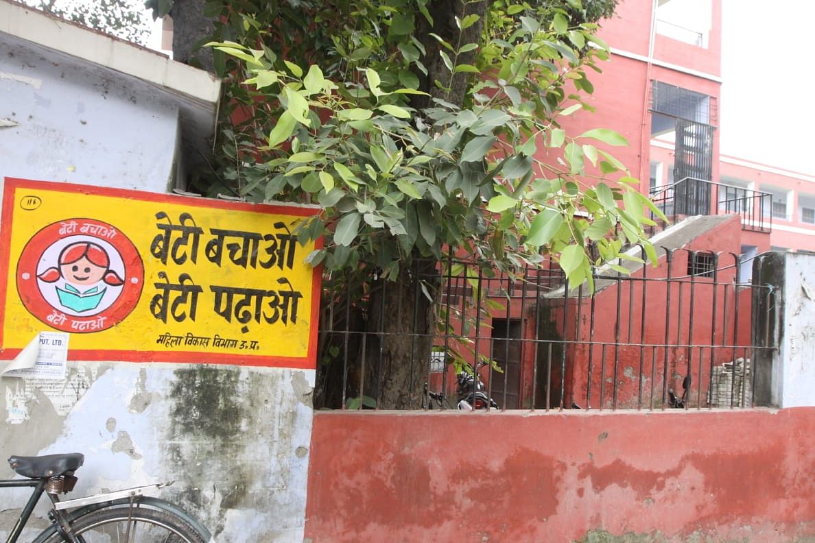 Posters of a womens helpline and the BJP's 'Save the Girl Child' campaign outside the Mumukshu complex | Praveen Jain