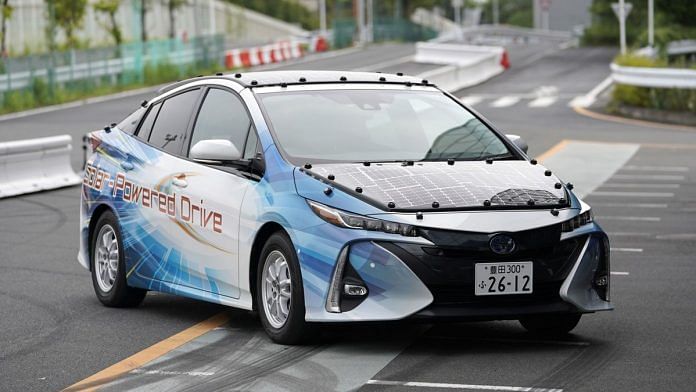 Toyota Motor Corp. Prius PHV plug-in hybrid vehicle equipped with a solar charging system, is pictured outside the MegaWeb Toyota City Showcase showroom in Tokyo Japan. | Photographer: Toru Hanai | Bloomberg