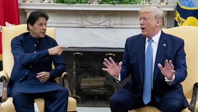 US President Donald J. Trump (R) and Prime Minister of Pakistan Imran Khan (L) deliver remarks to members of the news media, during their meeting in the Oval Office of the White House on 22 July 2019. | Bloomberg