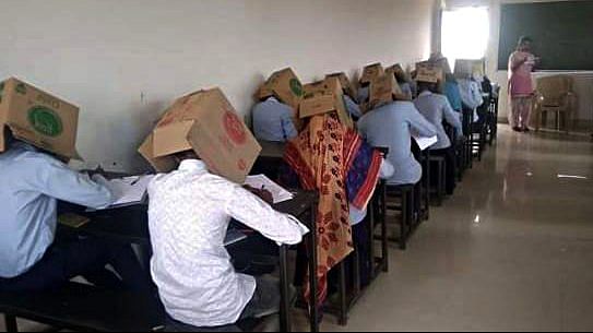 Students wear boxes during their exam at Bhagat pre-university college in Haveri | ANIPix