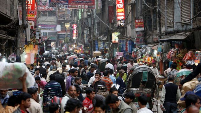 People walk through the Old Market of Dhaka, Bangladesh. | Photographer: Tomohiro Ohsumi | Bloomberg